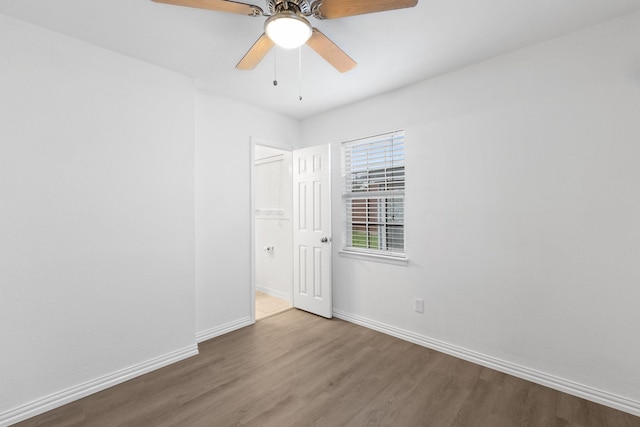 unfurnished room featuring ceiling fan and wood-type flooring