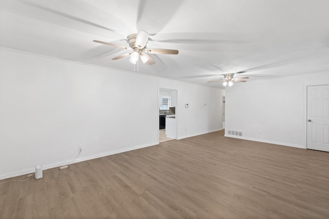 spare room featuring ceiling fan and wood-type flooring