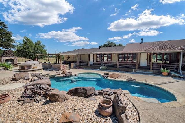 view of pool featuring a patio area and a jacuzzi