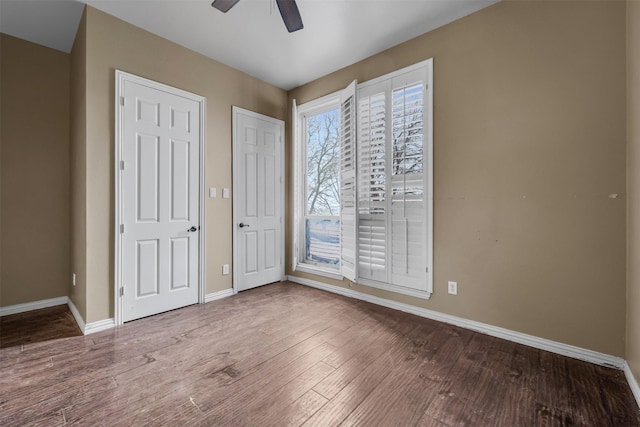 unfurnished bedroom featuring hardwood / wood-style floors and ceiling fan