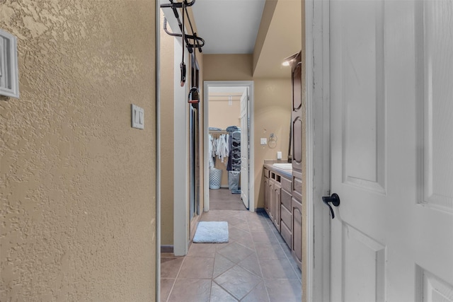 hall with light tile patterned flooring