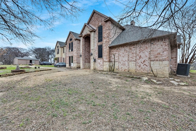 view of property exterior featuring central AC unit