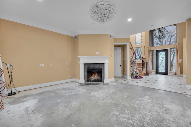 unfurnished living room featuring crown molding and concrete floors