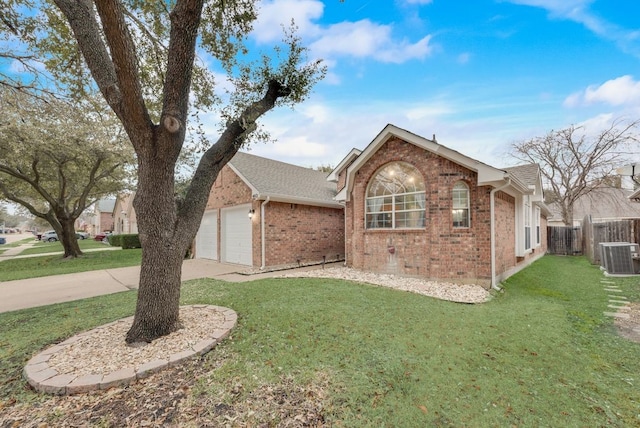 single story home with a garage, cooling unit, and a front yard