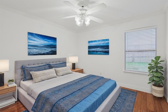 bedroom with crown molding, ceiling fan, and dark hardwood / wood-style flooring