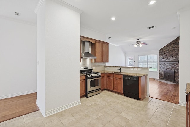 kitchen featuring sink, black dishwasher, kitchen peninsula, gas range, and wall chimney range hood