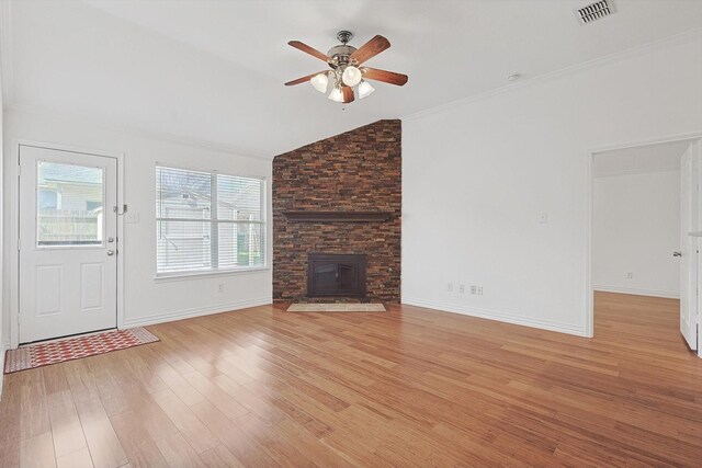 unfurnished living room featuring vaulted ceiling, ceiling fan, crown molding, and light hardwood / wood-style floors