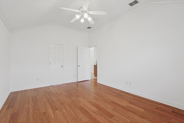 unfurnished bedroom featuring crown molding, hardwood / wood-style flooring, vaulted ceiling, and ceiling fan