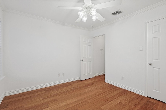 unfurnished room with ceiling fan, ornamental molding, and light wood-type flooring