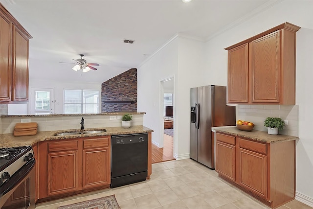 kitchen featuring appliances with stainless steel finishes, tasteful backsplash, sink, crown molding, and light stone countertops