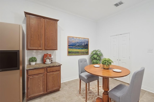 dining room featuring ornamental molding