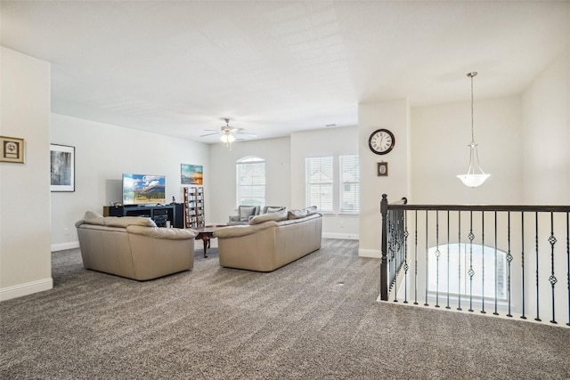 carpeted living room featuring ceiling fan