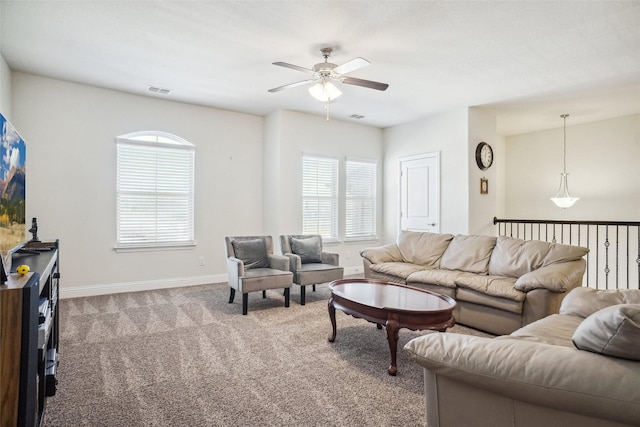 living room with ceiling fan and light colored carpet