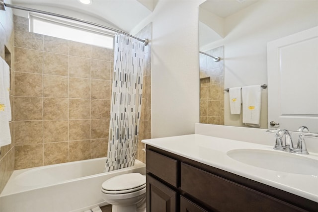 full bathroom featuring vanity, toilet, and shower / bath combo with shower curtain