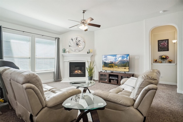 carpeted living room featuring ceiling fan