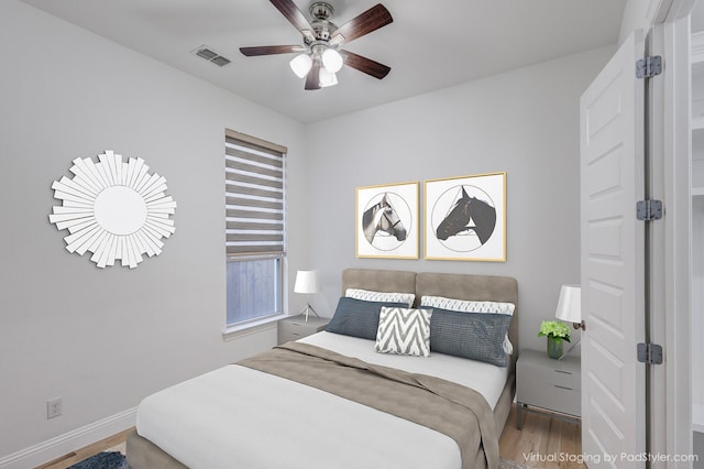 bedroom featuring ceiling fan and hardwood / wood-style floors