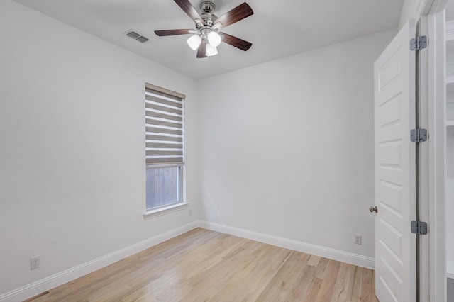 spare room featuring ceiling fan and light wood-type flooring