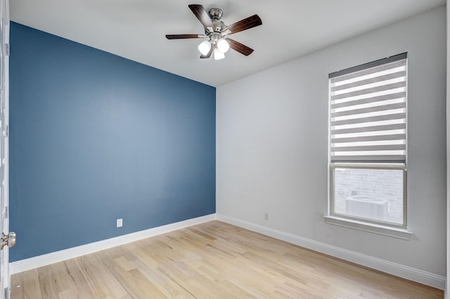 unfurnished room featuring ceiling fan and light hardwood / wood-style flooring