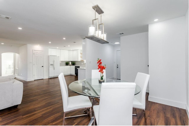 dining area with dark wood-type flooring