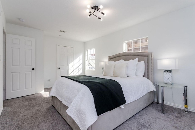 bedroom featuring light colored carpet