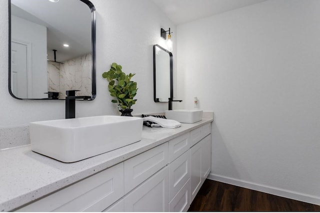 bathroom with hardwood / wood-style flooring and vanity