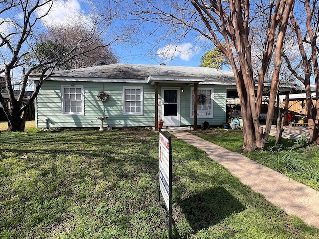 ranch-style house with a front lawn