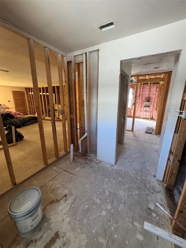 interior space featuring a textured ceiling