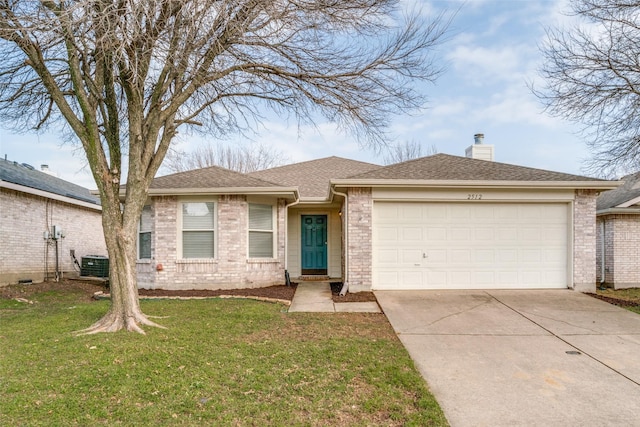 single story home with a garage, a front lawn, and central air condition unit