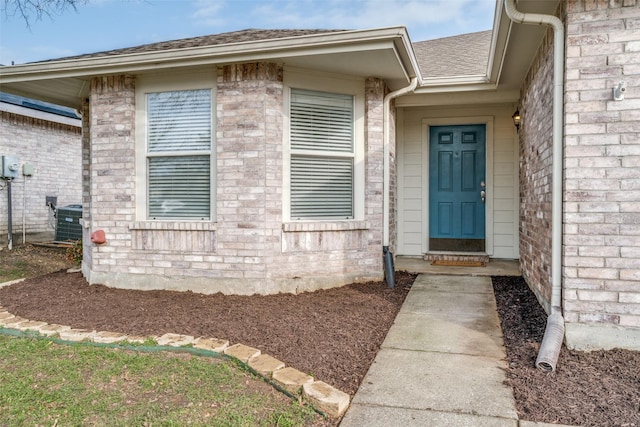 doorway to property with central AC