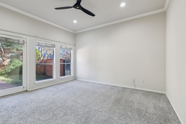 empty room featuring carpet floors, ornamental molding, and ceiling fan