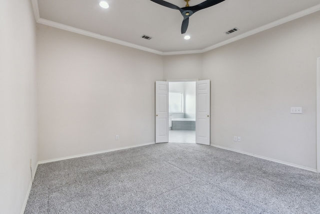 unfurnished room with crown molding, ceiling fan, and carpet flooring