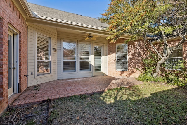 exterior space with ceiling fan