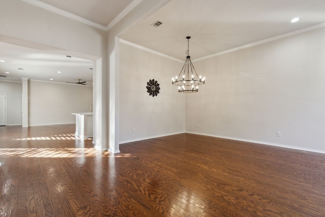 empty room with crown molding, dark wood-type flooring, and ceiling fan with notable chandelier