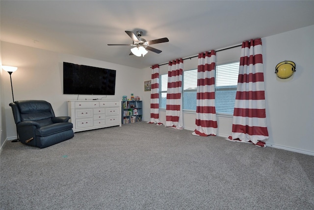 sitting room featuring ceiling fan and carpet flooring