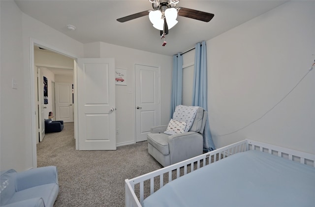 carpeted bedroom featuring ceiling fan