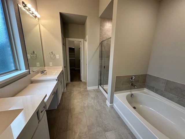 bathroom featuring vanity and plus walk in shower