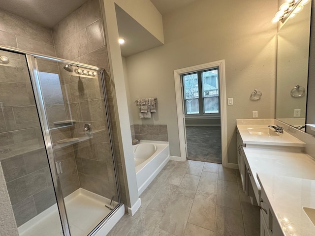 bathroom featuring vanity and shower with separate bathtub