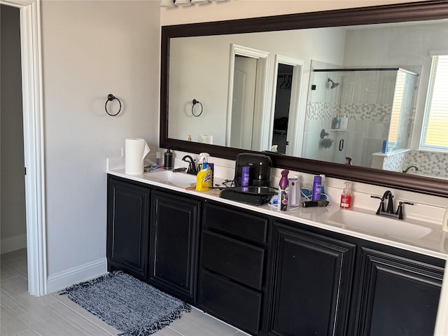 bathroom featuring vanity and a shower with shower door