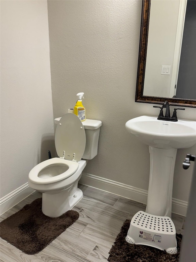 bathroom featuring toilet