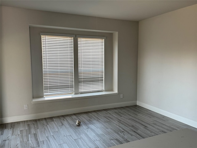 unfurnished room featuring light hardwood / wood-style flooring