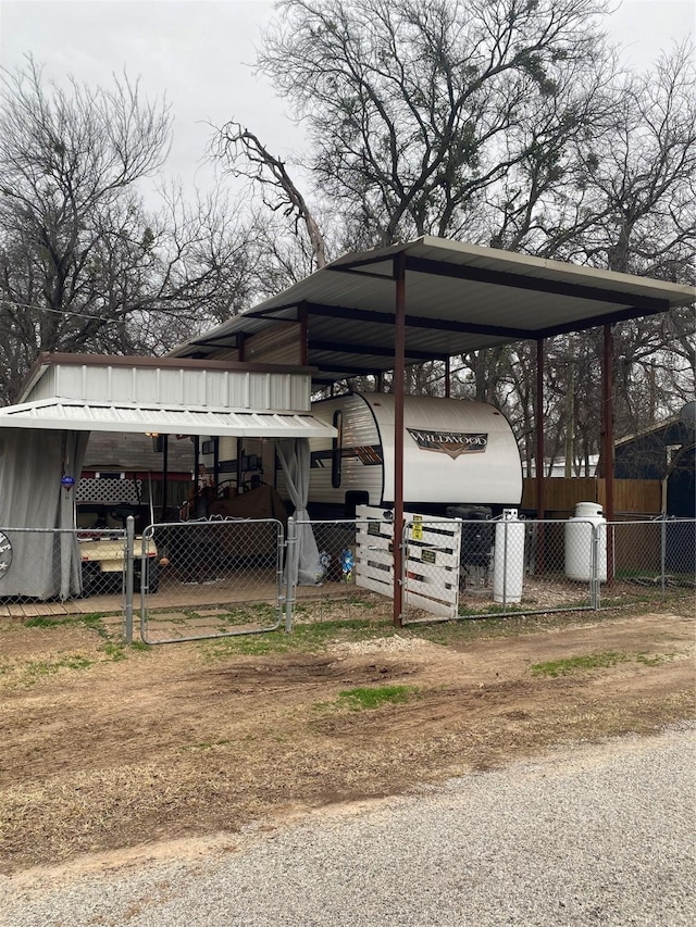 exterior space with a carport