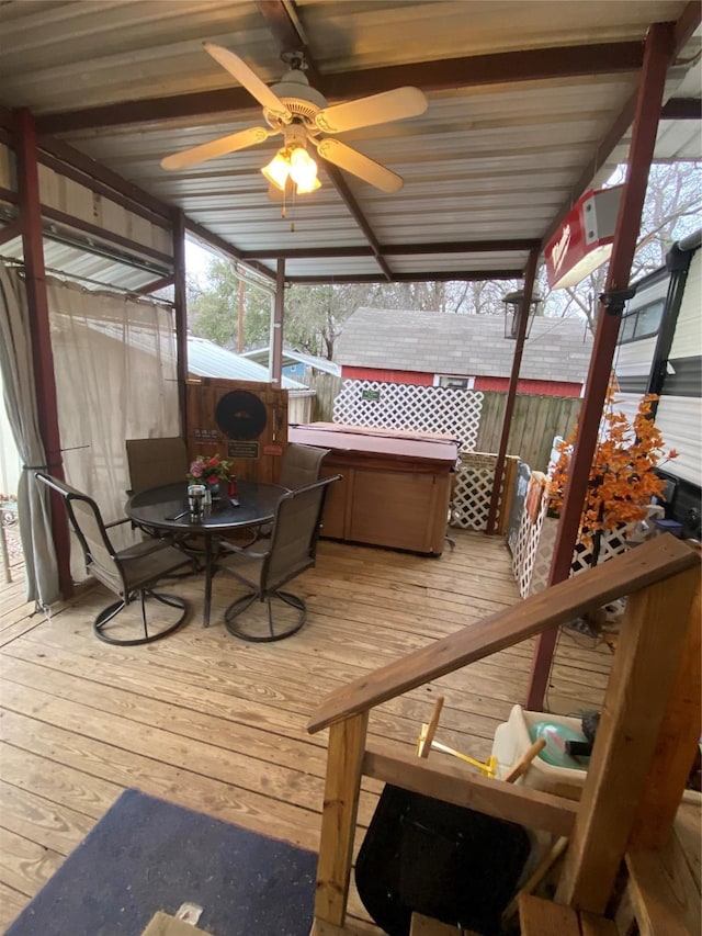 wooden terrace featuring a hot tub and ceiling fan