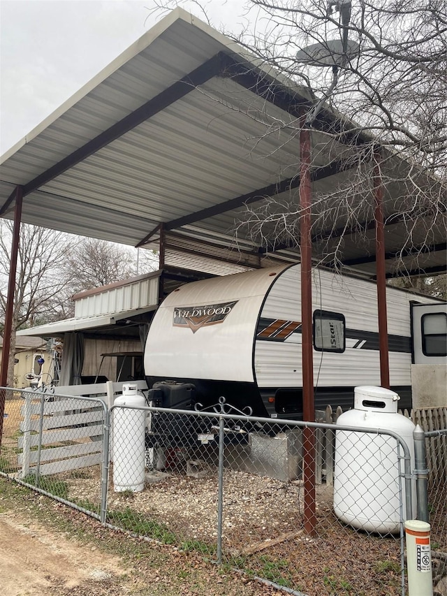 view of parking / parking lot featuring a carport