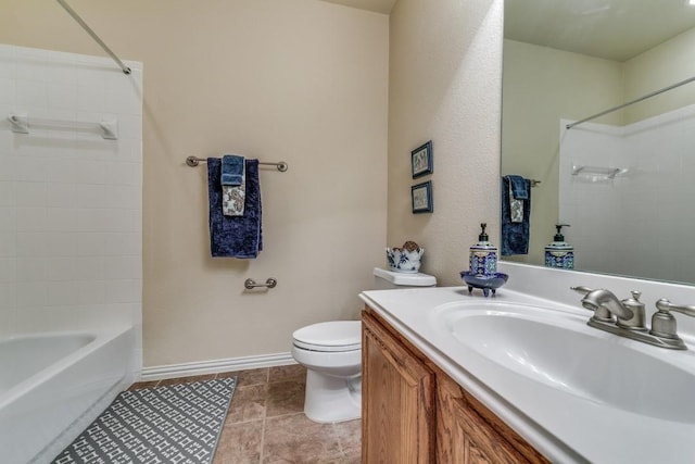 full bathroom with tile patterned floors, vanity, toilet, and tiled shower / bath