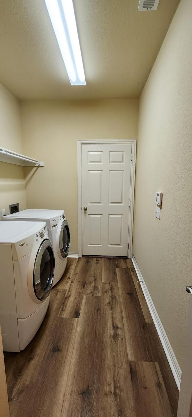 2821 Fordham Rd, Plano, TX 75025 - laundry area featuring independent washer and dryer, wood finished floors, and baseboards