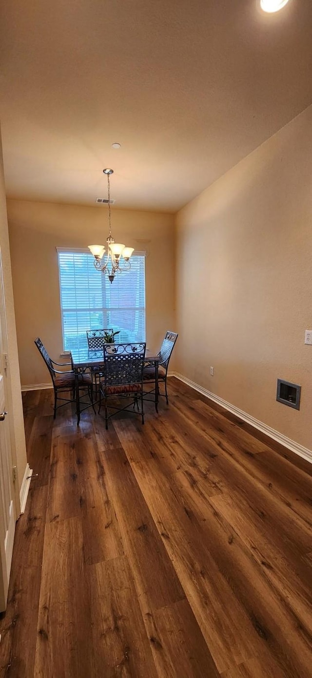 2821 Fordham Rd, Plano, TX 75025 - dining room featuring dark wood finished floors, baseboards, and a chandelier