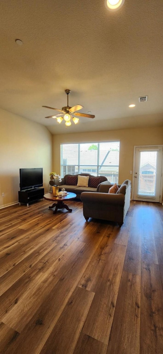 2821 Fordham Rd, Plano, TX 75025 - living area with wood finished floors, healthy amount of natural light, ceiling fan, recessed lighting, and a textured ceiling