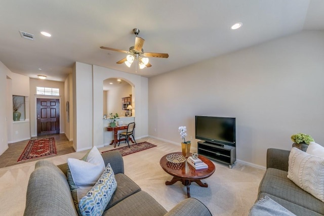 living room with light colored carpet and ceiling fan