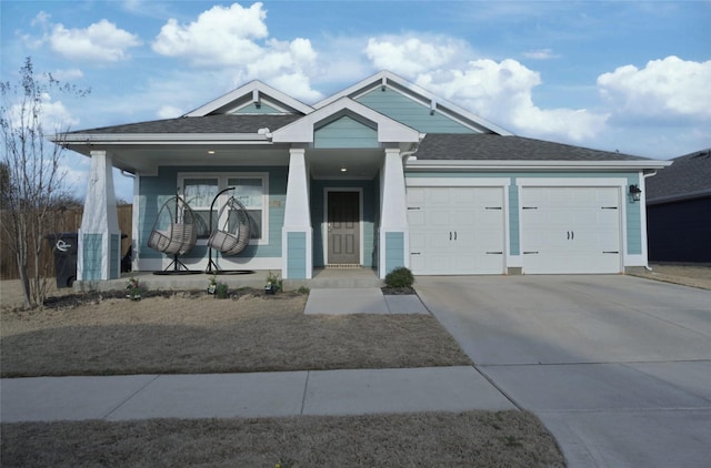 view of front of house with a garage and covered porch