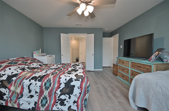 bedroom featuring ceiling fan and light hardwood / wood-style flooring